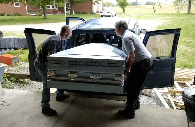 Men carrying casket